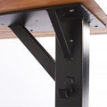 Rockless Table T-Base supporting a rectangular wood table top on its wide two-foot footprint