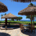 Rockless Table bases supporting large round tables on an outdoor patio with uneven flooring