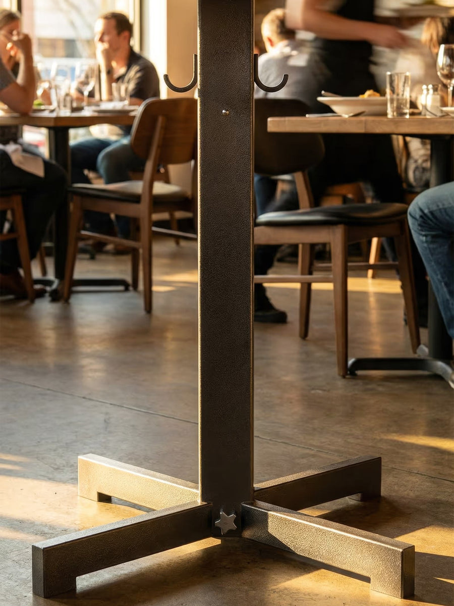 Rockless Table base being set down on an uneven surface where it levels itself