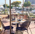Rockless Table bases installed under dining tables in a restaurant dining room